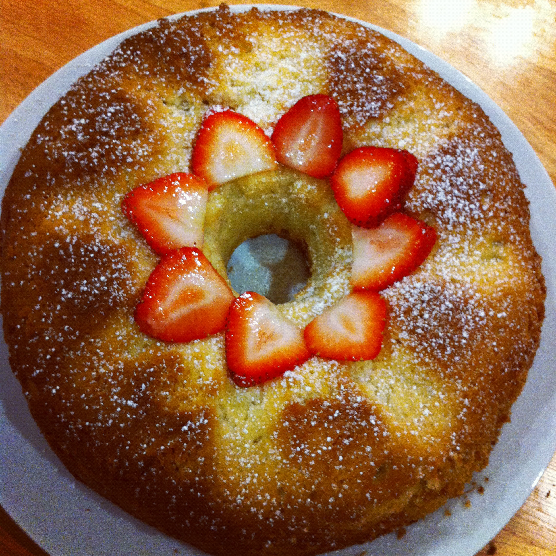 I decorated this beauty with strawberries and dusted a little powdered sugar as well. Beautiful.