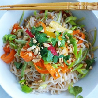 Fresh Asian Rice Noodle Bowl! Raw veggies, on top of seasoned rice noodles with limes, cilantro and crushed peanuts! So easy!