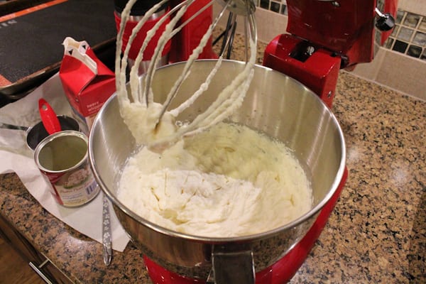 Cream being whipped in a KitchenAid mixer for Blueberry Lemon and Thyme Ice Cream.