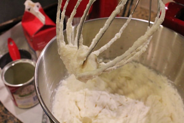 Close up of cream being whipped in a KitchenAid mixer for Blueberry Lemon and Thyme Ice Cream.