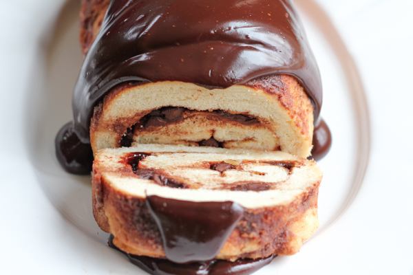 Cinnamon Chocolate Swirl Crunch Bread! With a cinnamon chocolate swirled through the middle of the bread and a chocolate ganache on top, this bread is magical and delicious!