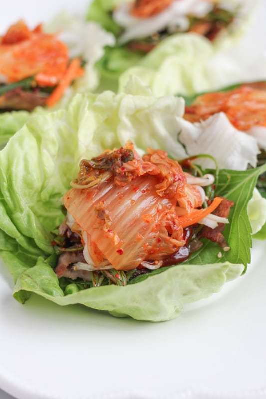 Pork Belly Lettuce Wraps on a white plate.