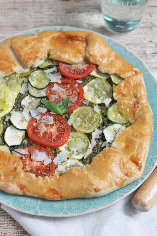 Summer Vegetable Galette with Pesto on a plate with a napkin.
