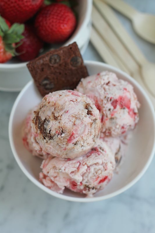 Strawberry Cheesecake Brownie Brittle Ice Cream in a bowl.