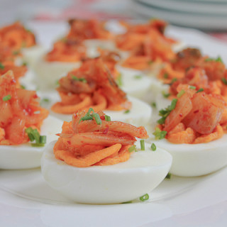 Kimchi Deviled Eggs! A fun and delicious twist on deviled eggs. Spicy, flavorful and soooo good! We hope you try these!
