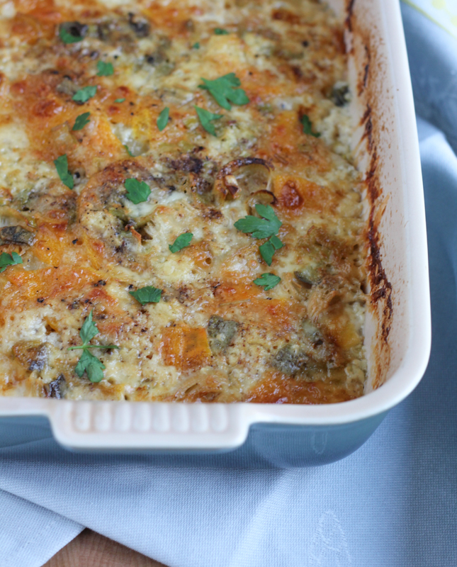 Layers upon layers of potatoes, leeks, butternut squash and Fontina cheese, this Autumn Potato Gratin needs to be on every Thanksgiving table this year! Don't miss this fabulous recipe.