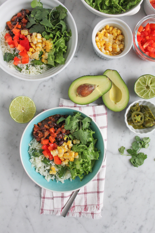 Fire Roasted Garlic Vegetarian Chili served over cilantro lime rice and topped with a ton of fresh veggies. Have dinner on the table in about 30 minutes! #weeknightdinner #SundaySupper #McSkilletSauce #quickrecipe