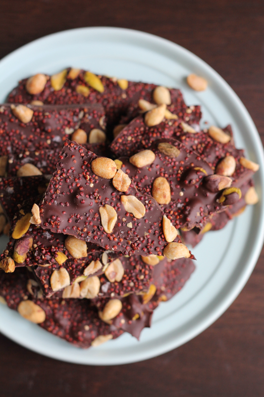 Sweet, salty and nutty, this Toasted Quinoa Chocolate Bark has it all. The toasted red quinoa, pistachios and roasted peanuts add a great balance of nuttiness. This is the perfect snack or gift for chocolate lovers! #chocolatebark #vanillaweek #valentinesday