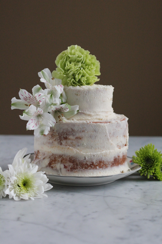 Say I love you this Valentine's Day with a strawberry cake! This cake is perfectly moist and sweet and filled with fresh strawberries! #VanillaWeek #cake #ValentinesDay