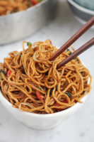 vegetable chow mein in bowl with chopsticks