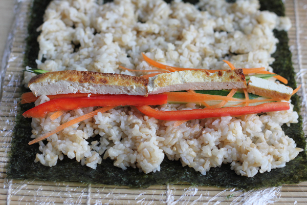 The Spicy Tofu Roll! Filled with raw vegetables and pan-fried tofu and a spicy sauce, this is the perfect spicy roll for vegetarians! #sushi #rolls #DIY #tofu #asianfood