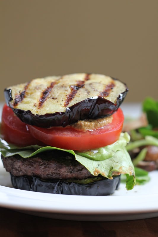 A plate with a Grilled Eggplant Bun Burger.