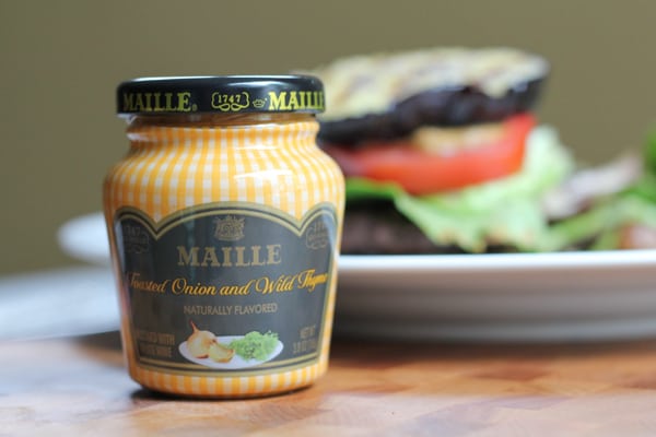 A jar of mustard for Grilled Eggplant Bun Burgers.