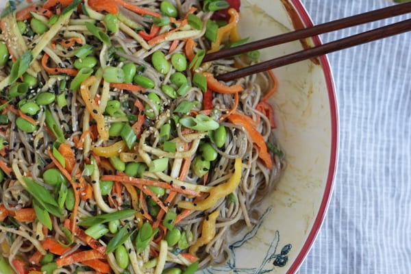 A bowl of Light Asian Noodle Salad with chopsticks.