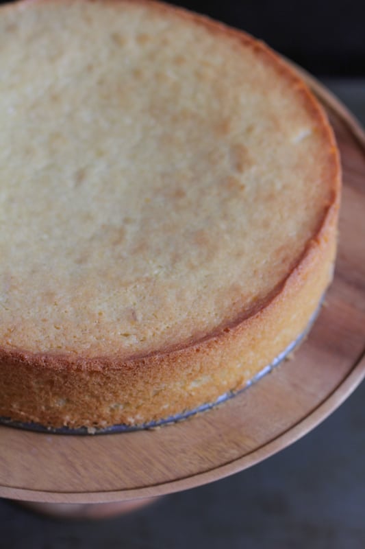 Olive Oil Honey Cake on a wooden cake stand.