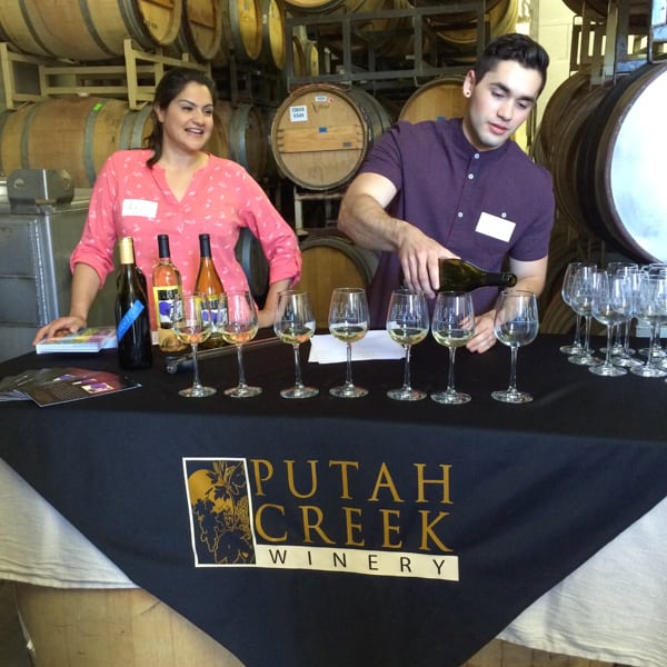 Wine being poured for a California winery tasting.