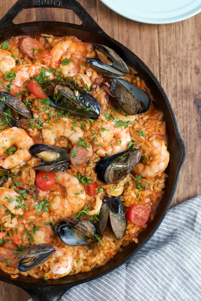 Seafood Paella recipe being made in black paella pan