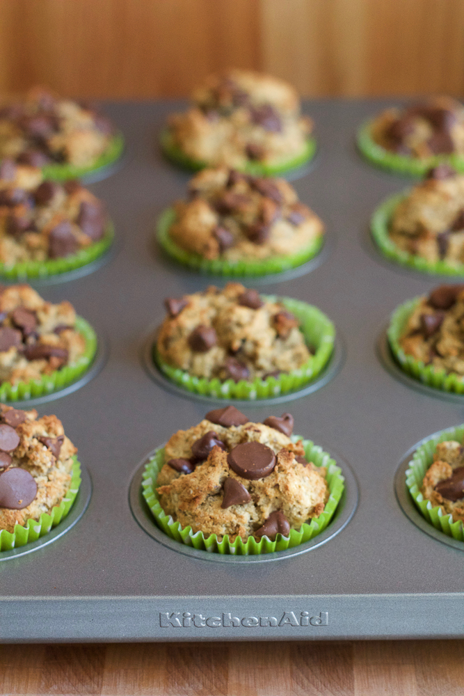 Healthy Wheat Almond Coconut Flaxseed Muffins! Made with a wheat and almond flour, coconut flour and ground flaxseed, these muffins have taste, texture and are filled with goodness! You don't have to feel guilty about indulging in one of these muffins!