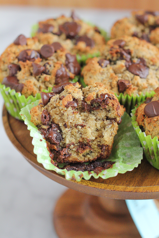 Healthy Wheat Almond Coconut Flaxseed Muffins! Made with a wheat and almond flour, coconut flour and ground flaxseed, these muffins have taste, texture and are filled with goodness! You don't have to feel guilty about indulging in one of these muffins!