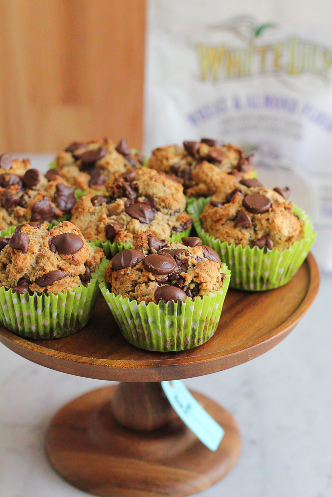 Healthy Wheat Almond Coconut Flaxseed Muffins! Made with a wheat and almond flour, coconut flour and ground flaxseed, these muffins have taste, texture and are filled with goodness! You don't have to feel guilty about indulging in one of these muffins!