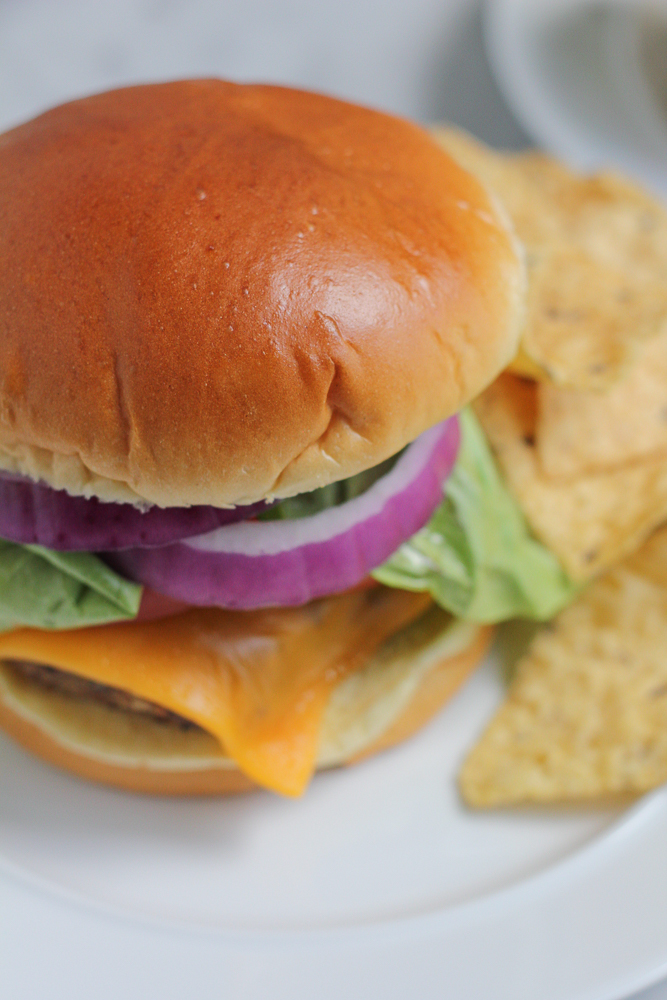 Classic Burger Recipe for summer! Nothing beats a homemade beef burger patty fresh off the grill and stacked into a nice big juicy burger. Celebrate summer backyard BBQs right and make this!