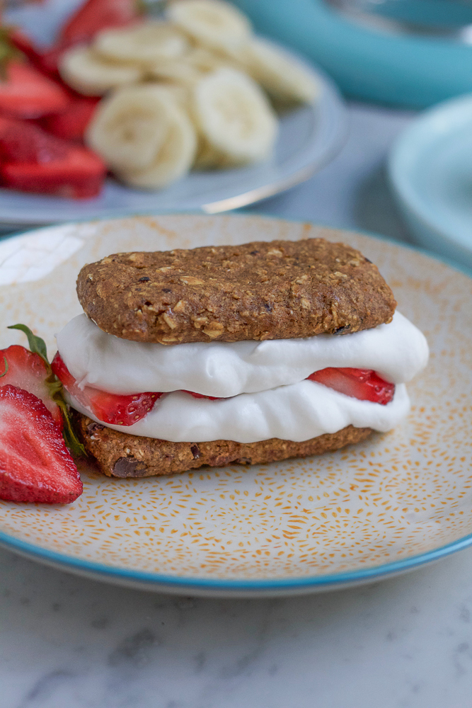 Coconut Cream Snack Bars! Homemade whipped coconut cream with strawberries and bananas sandwiched in between Van's Banana Bread Snack Bars! What could be better?! and they're gluten free!
