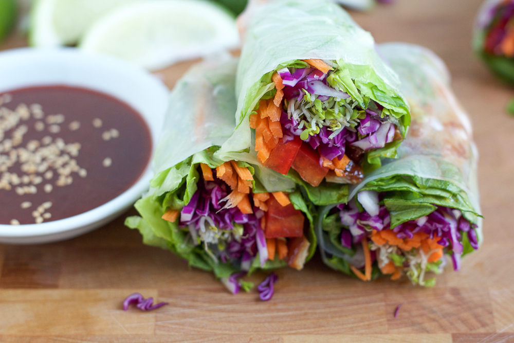 A healthy weekly meal plan featuring Asian Chicken Spring Rolls, Chopped Mexican Kale Salad with Creamy Avocado Dressing, Spicy Lime Grilled Shrimp and more!