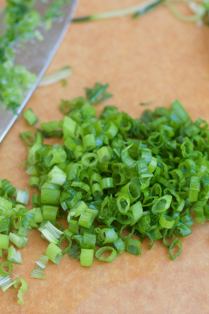 Spicy Korean Noodle Salad! Light, fresh and filled with veggies and mache rosettes! Make it spicy or non-spicy! This is the perfect summer meal and only takes about 15 minutes to make!