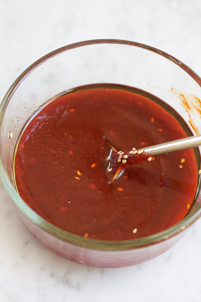 Spicy Korean Noodle Salad! Light, fresh and filled with veggies and mache rosettes! Make it spicy or non-spicy! This is the perfect summer meal and only takes about 15 minutes to make!