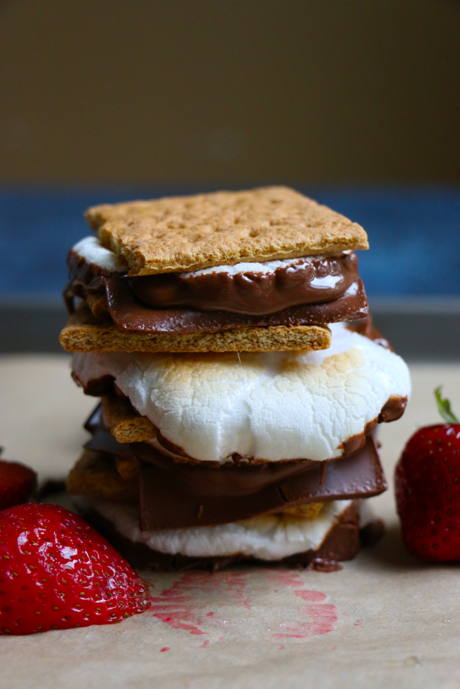 Easy S&rsquo;mores At Home! All made in your oven! Completely indulgent and yummy, this is the perfect quick, summer treat to make at home and share with friends and family!