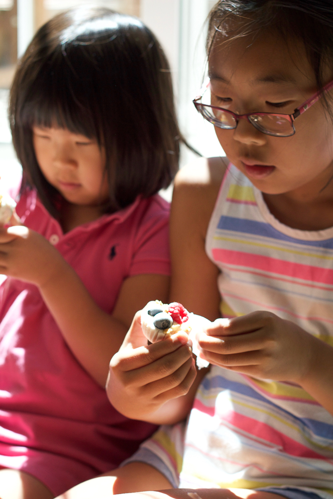 Kids eating Frozen Berry Yogurt Bites.