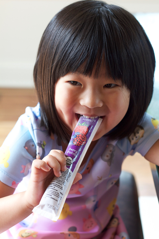 Eating yogurt tubes used to make Frozen Berry Yogurt Bites.