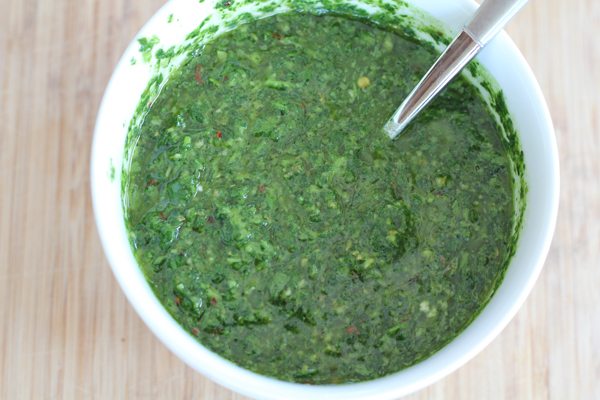 A bowl of chimichurri sauce for Grilled Cauliflower Steaks.