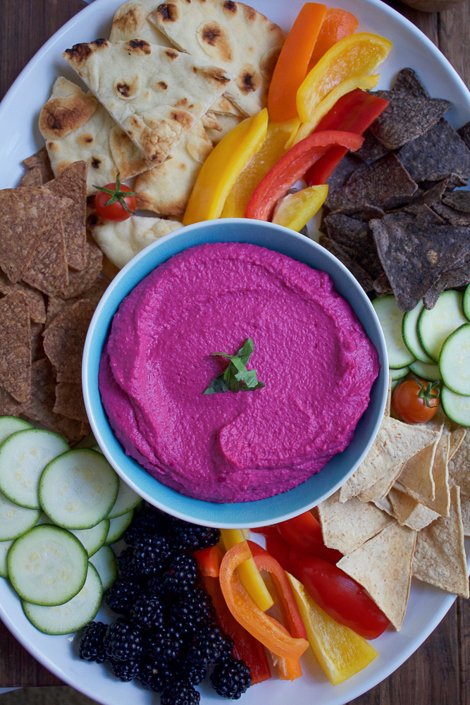 Roasted Beet Hummus. Try this delicious, vibrant twist on one of your favorite foods to snack on! Serve this beet hummus with raw veggies, chips and pita bread. This makes for a great party or appetizer platter.