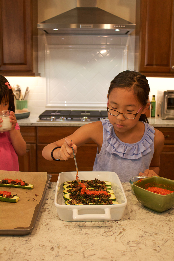 Making Quinoa Stuffed Zucchini Boats.