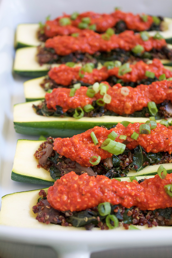 A baking dish with Quinoa Stuffed Zucchini Boats.