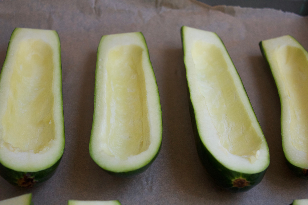 Hollow zucchini halves for Quinoa Stuffed Zucchini Boats.