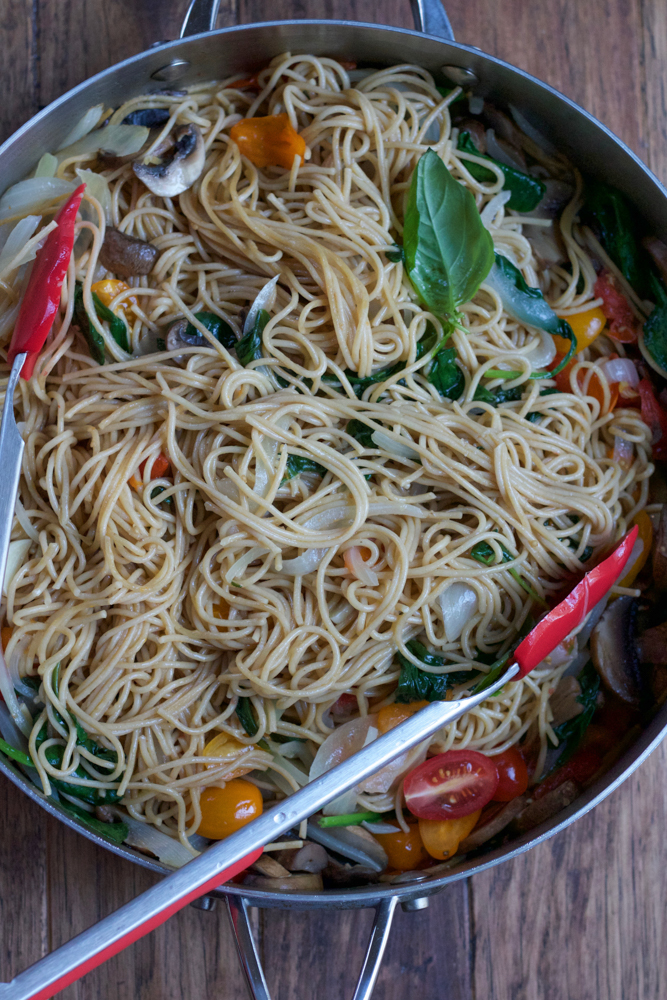 A pot of One Pot Pasta with tongs.