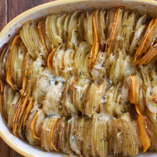 Hasselback Potato Gratin. Slices of Yukon gold potatoes and sweet potatoes, topped with a delicious and light cheesy cream sauce.