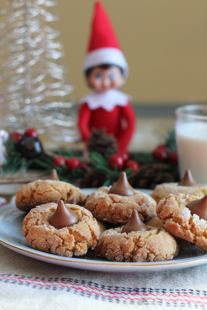 Holiday Peanut Butter Blossoms! Traditional, peanut buttery blossom crinkle cookies dressed up for the holidays! Drizzle on white or dark chocolate and decorate with festive, holiday sprinkles for fun!