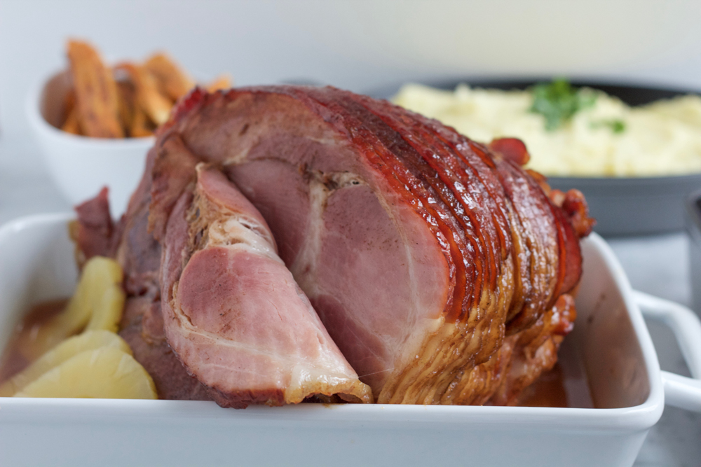 Spiral Cut Double Glazed Brown Sugar Ham with Sweet Potato Casserole!! The perfect holiday dinner! A Spiral Cut Double Glazed Brown Sugar Ham from ALDI and my homemade Sweet Potato Casserole! Add some savory side dishes and you've got the best holiday dinner!