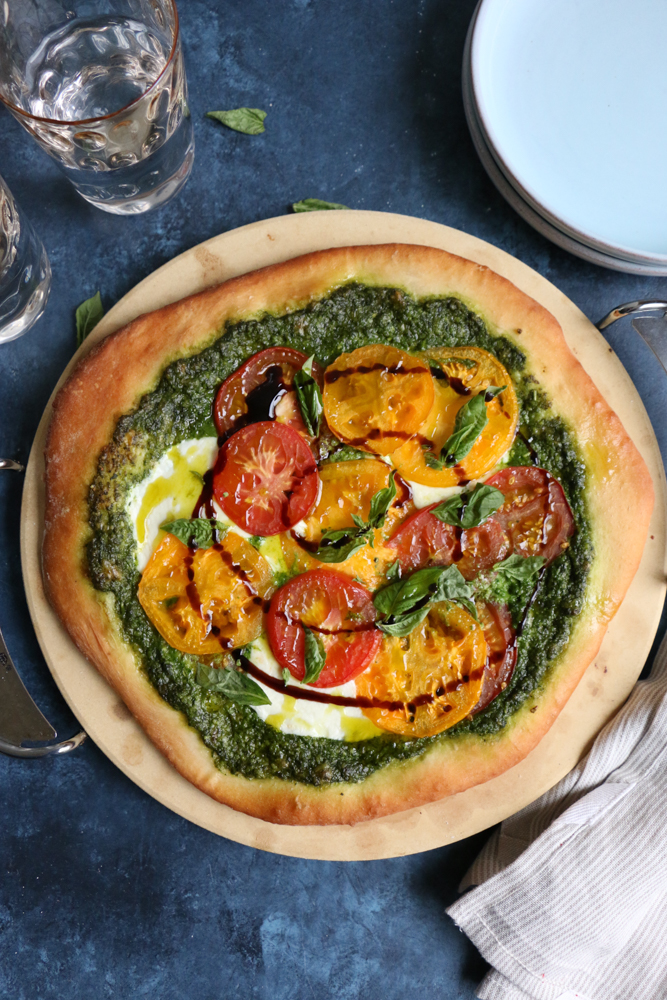 Delicious Caprese Pesto Pizza with a homemade pizza crust made with White Lily Flour! So good and so easy to make!