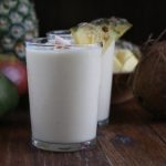Refreshing Tropical Coconut Smoothie made with Torani Coconut Syrup, frozen mangos, pineapples and more! Let this smoothie transport you to someplace tropical and fabulous!