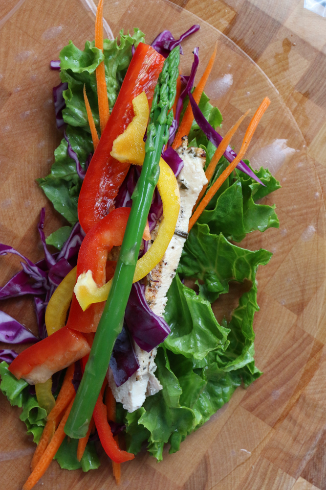 Veggies and chicken on a spring roll wrapper for Chicken and Veggie Spring Rolls.
