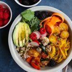 The Best Vegan Buddha Bowl ever!!! Filled with farro, mixed greens and arugula, carrot ribbons, grilled veggies, roasted spiralized golden beets, blackberries and more! This Buddha Bowl is packed with macronutrients and everything good!