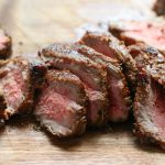 slices of medium rare steak marinated with homemade steak marinade