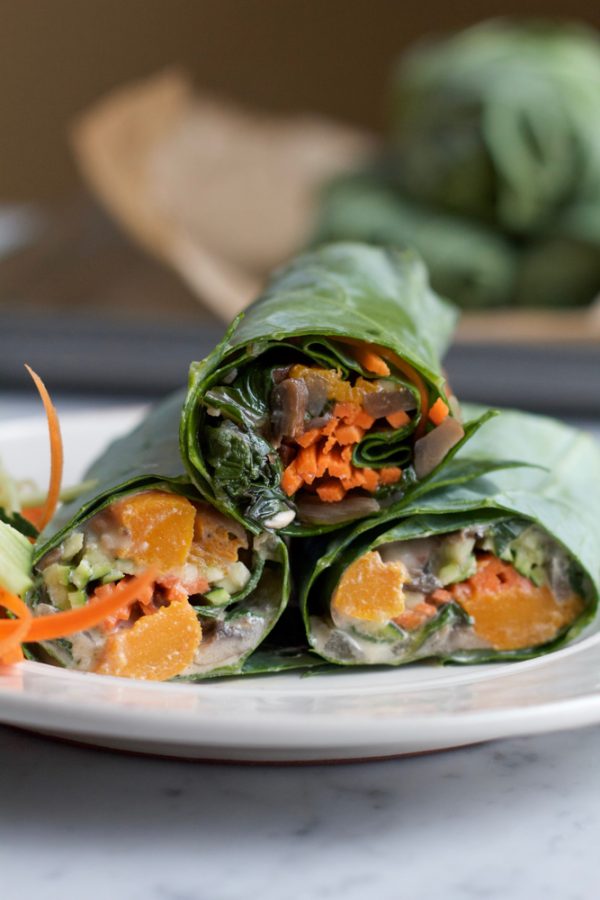 Roasted Butternut Squash Collard Wraps! A healthy and delicious way to enjoy some of your favorite veggies! Try them with homemade tahini sauce, or my spicy peanut sauce! Either way, make these wraps!
