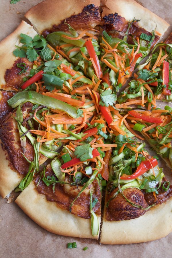Vegan Asian Spring Roll Pizza! Everything fresh and delicious you love about Asian Spring Rolls. . on a pizza! And the spicy peanut sauce has amazing flavor that ties everything together! You will love this pizza!