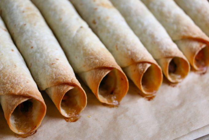 Chicken Veggie Taquitos + A Giveaway! BBQ baked shredded chicken and sauteed vegetables, rolled up into crispy, delicious BAKED taquitos! Great for packing into school lunches!