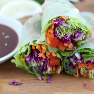 Spicy Asian Chicken Spring Rolls! Packed with a spicy and flavorful chicken and lots of veggies. These spring rolls are fresh, delicious and so easy to make!